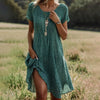 Armanda | Elegantes grünes Punkte-Midikleid mit kurzen Ärmeln