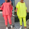 Haleigh | Rundhalsausschnitt mit Schlitz. Fluoreszierender Freizeitanzug für Damen